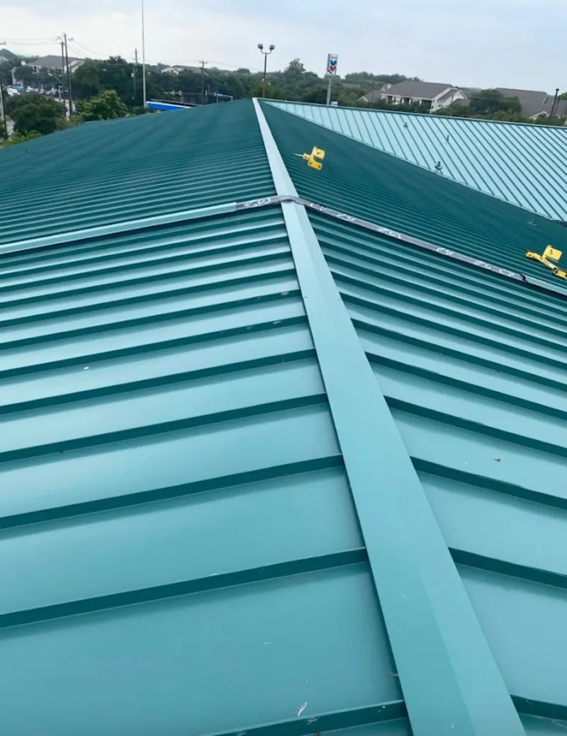 Green commercial metal roof ridge and valley for Metal Roof Repair in Callaway
